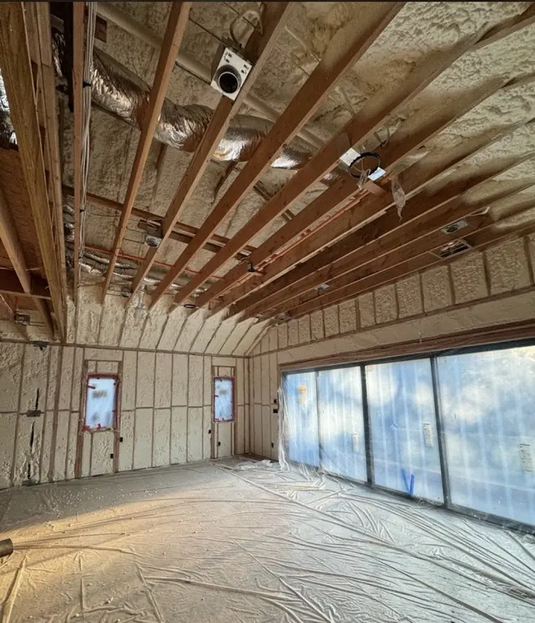 Interior walls and ceiling insulated with spray foam during new construction in Old Orchard Beach